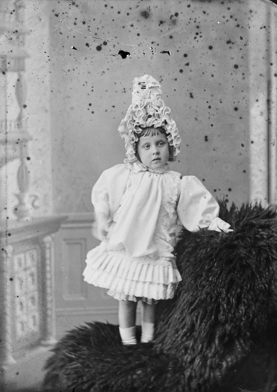 Young Girl with Elaborate Headwear