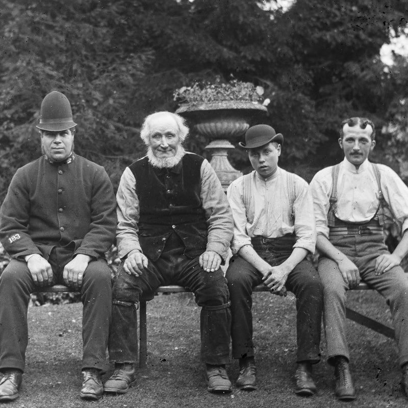 Four Seated Gentlemen on a Bench