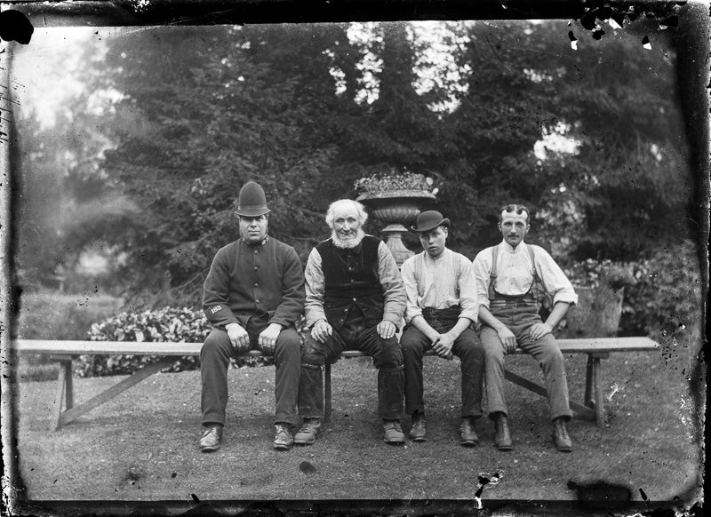 Four Seated Gentlemen on a Bench