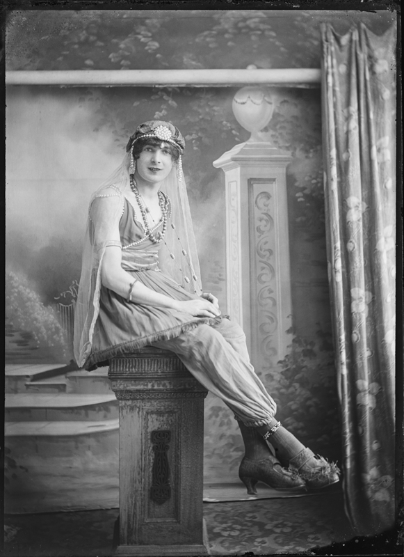 Seated Cross Dressing Individual
